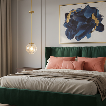 Aurelia polished brass pendant light glowing beside a colorful modern bedroom