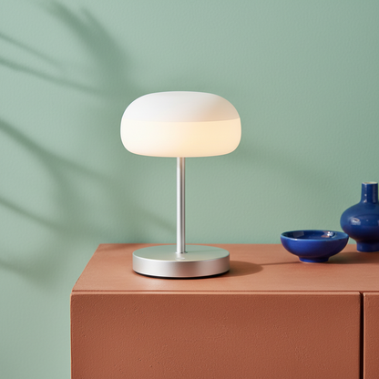Close-up detail of the Luna silver base, stem, and frosted rounded shade