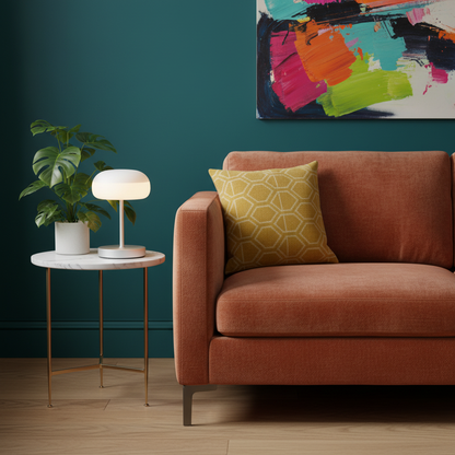 Luna compact silver table lamp glowing on a colorful living room side table