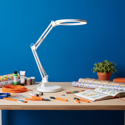 Lumina Flex white spring-arm ring lamp on a colorful maker desk