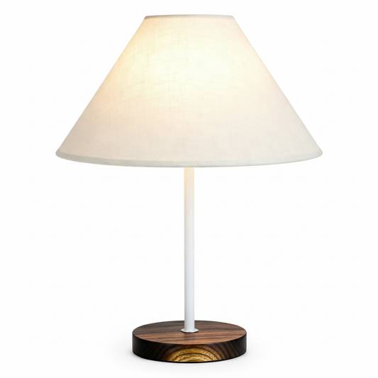 Arden table lamp with a soft white shade, white stem, and dark wood base on a white background