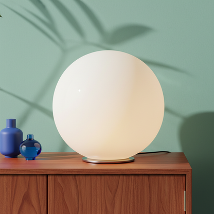 Close-up of the Orbelle glowing white sphere and polished silver circular base