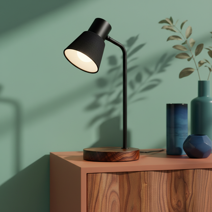 Close-up of the Cedar Arc matte black shade and dark wood lamp base
