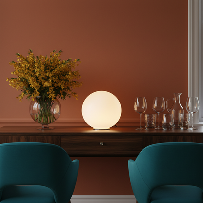 Orbelle glowing white sphere table lamp on a colorful dining room sideboard
