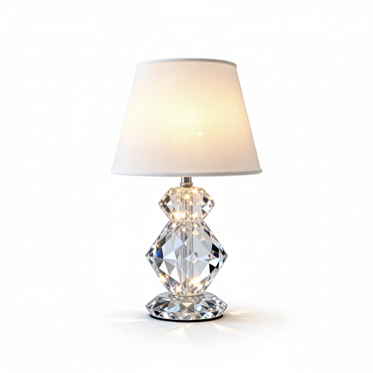 Prismelle crystal table lamp with a soft white shade and faceted base on a white background